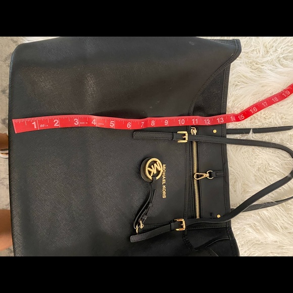 Black leather Michael Kors tote bag with gold-toned accents and flat handles. - Picture 12 of 12